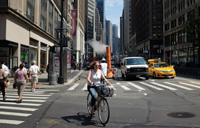 woman biking on street woman biking on street