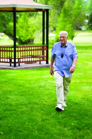 Alert1 Senior Wearing Button While Golfing Alert1 Senior Wearing Button While Golfing