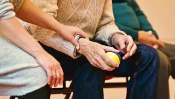 senior being assisted senior being assisted