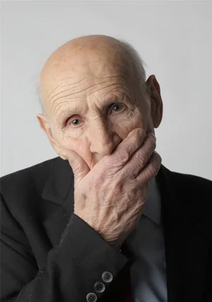 Elderly Man Covering His Face Elderly Man Covering His Face