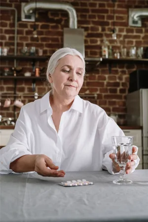 Elderly Woman Taking Medication Elderly Woman Taking Medication