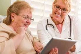 Nurse Showing Senior A Tablet Nurse Showing Senior A Tablet