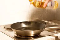 Pouring Oil in Skillet Pouring Oil in Skillet