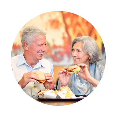Senior couple eating fast food together. Senior couple eating fast food together.