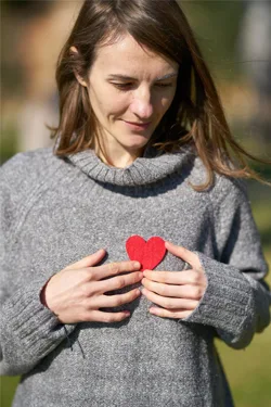 Red Felt Heart On Womans Sweater Red Felt Heart On Womans Sweater