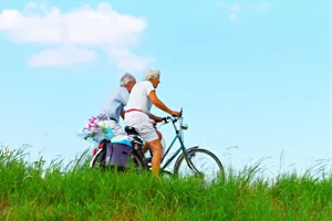 Senior Couple Riding Bikes Senior Couple Riding Bikes