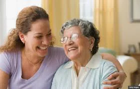 Senior and Caregiver Laughing Senior and Caregiver Laughing