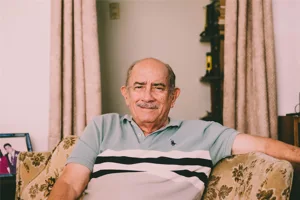 Smiling Grandpa Sitting In Chair Smiling Grandpa Sitting In Chair