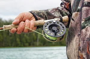 Weathered Hand Holding Fishing Pole Weathered Hand Holding Fishing Pole