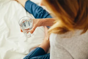 Woman Holding Glass of Water Woman Holding Glass of Water