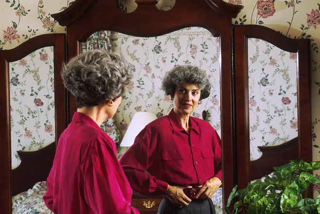 woman looking in mirror woman looking in mirror