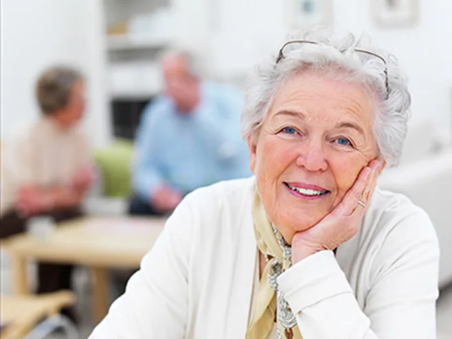 Elderly woman in white cardigan Elderly woman in white cardigan