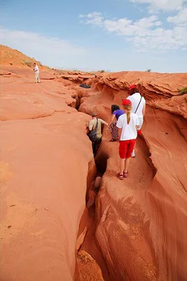 Hikers exploring a canyon Hikers exploring a canyon