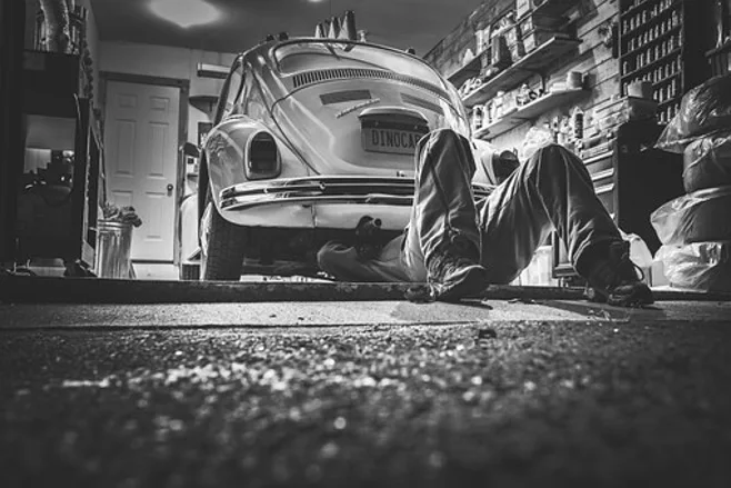 fixing car in garage fixing car in garage