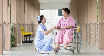 caregiver helping cripple caregiver helping cripple