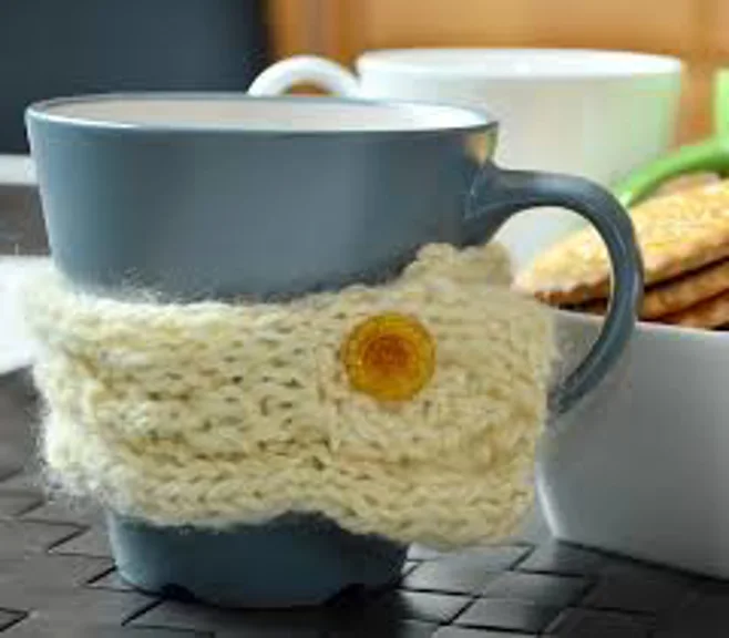 blue coffee cup with crochet cozy blue coffee cup with crochet cozy
