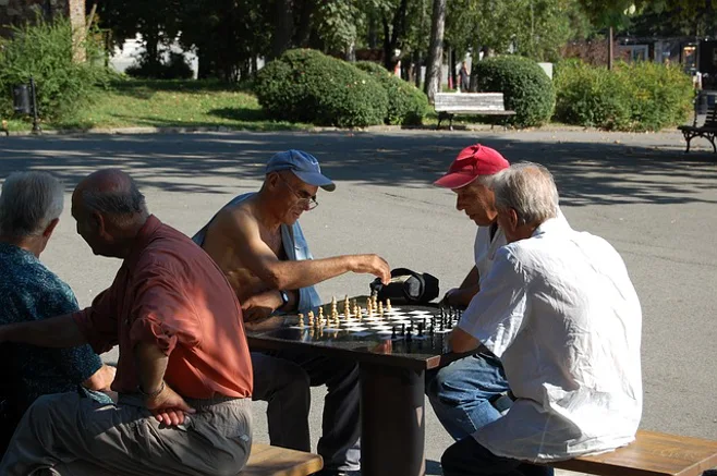 men playing chess men playing chess