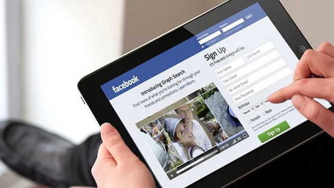 Facebook on tablet. Facebook on tablet.