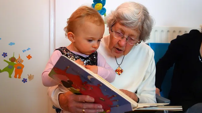 grandma reading to grandchild grandma reading to grandchild