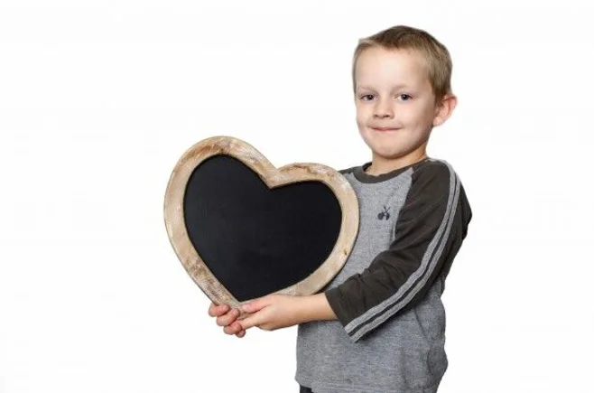 kid with blackboard heart kid with blackboard heart