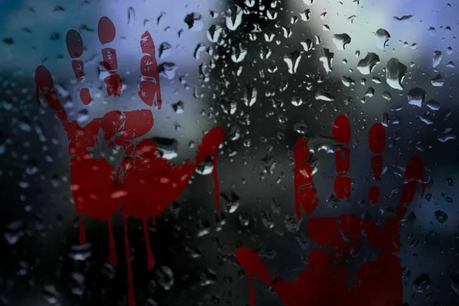 red hand prints on window red hand prints on window
