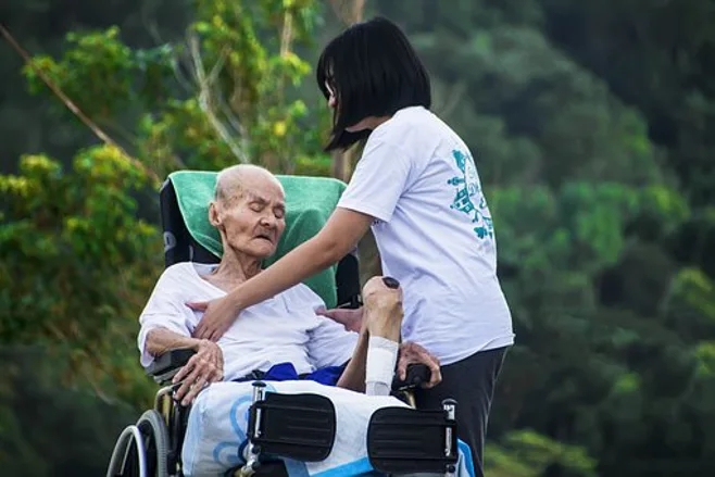 young caregiver taking care of grandma young caregiver taking care of grandma
