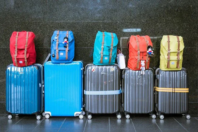 backpacks on suitcases in airpot backpacks on suitcases in airpot