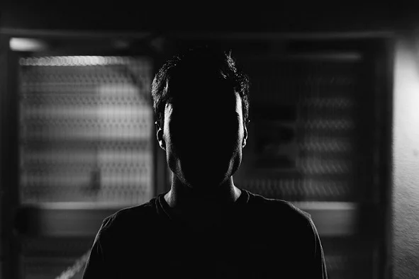 A man lurking in the shadows A man lurking in the shadows