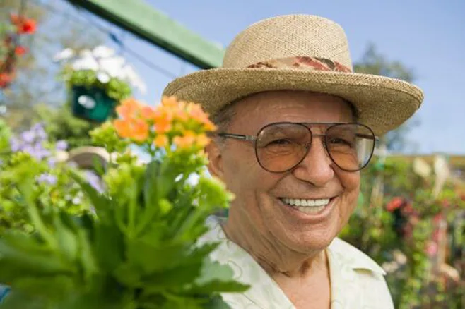 smiling man in garden smiling man in garden