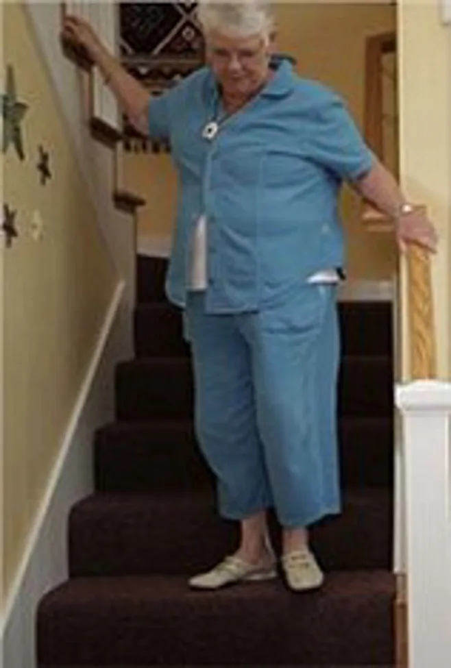 woman on stairs.alert1medicalalertsystems woman on stairs.alert1medicalalertsystems