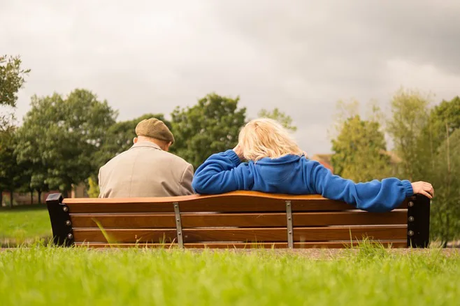 couple sitting on a bench couple sitting on a bench