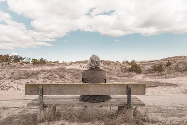 grandma on bench in desert grandma on bench in desert