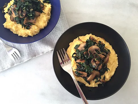 Creamy polenta with mushrooms and kale