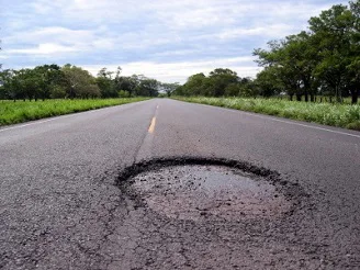 A pothole on a street A pothole on a street