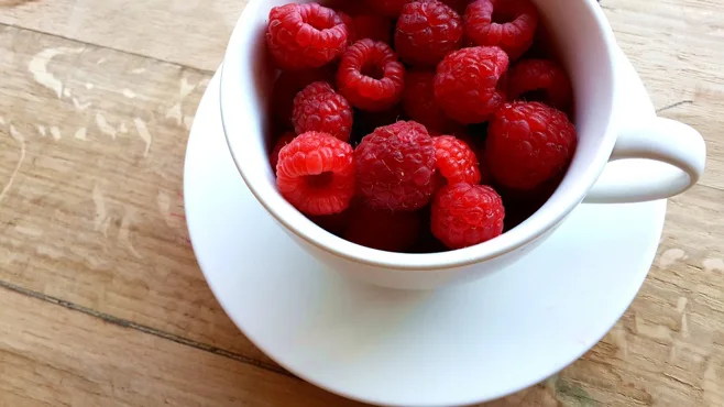 raspberries in mug raspberries in mug