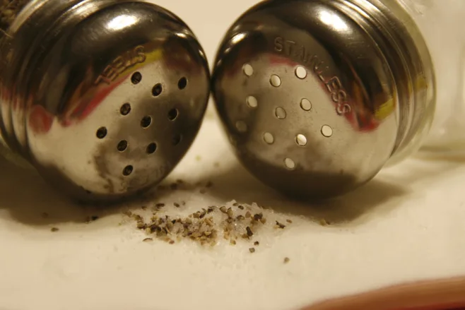 Closeup of tops of Salt and Pepper shakers Closeup of tops of Salt and Pepper shakers