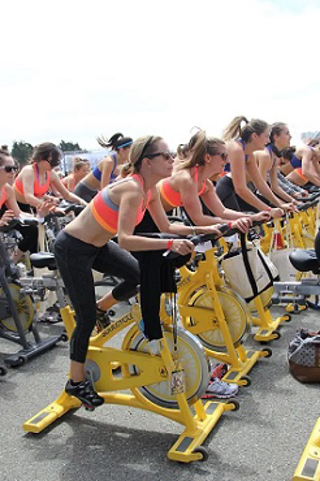 woman cycling class woman cycling class