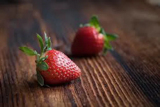 Strawberries on rustic table Strawberries on rustic table