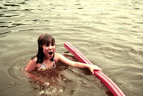 Girl swimming in a lake