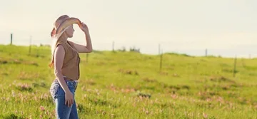 woman looking at grass field woman looking at grass field