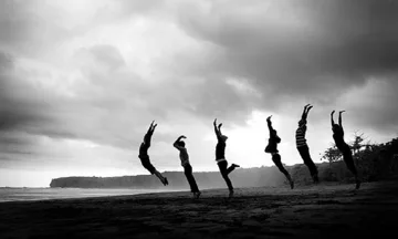 women jumping on beach women jumping on beach